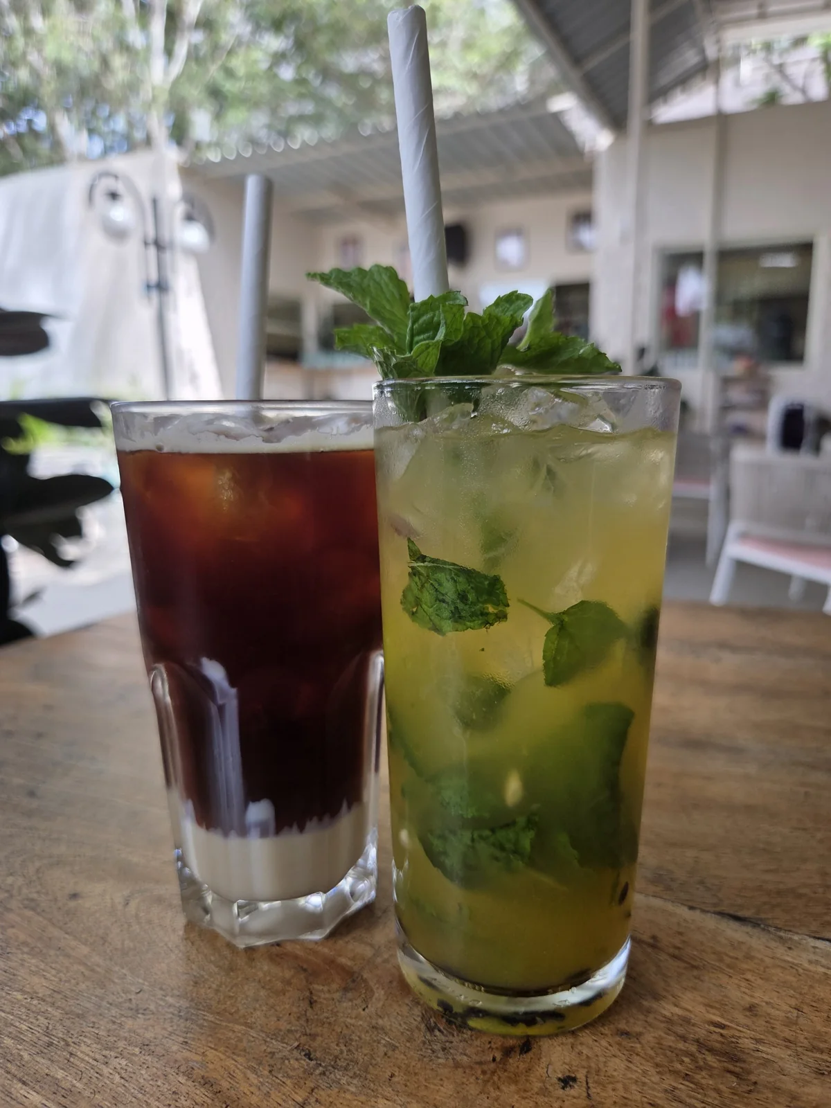 Two chilled drinks on a wooden table — illustrative photography