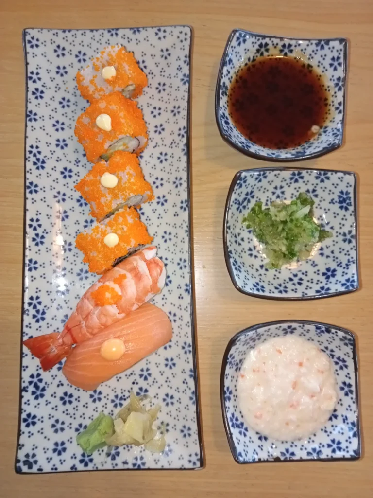 Sushi rolls with ginger and wasabi — illustrative photography